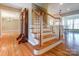 Wooden staircase with white risers and railing at 1300 Old Farm Rd, Charlotte, NC 28226