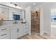 Elegant bathroom with a walk-in shower, modern vanity, and large mirror at 132 Rollingwood Ln, Mooresville, NC 28117