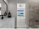 Bathroom with a vanity, and view of lake from doorway at 132 Rollingwood Ln, Mooresville, NC 28117