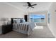 Spacious bedroom with lake view, comfortable bed, and ample natural light at 132 Rollingwood Ln, Mooresville, NC 28117