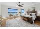 Main bedroom with lake views and ceiling fan at 132 Rollingwood Ln, Mooresville, NC 28117