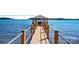Covered dock with boat lift and water access at 132 Rollingwood Ln, Mooresville, NC 28117
