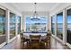 Bright dining room with lake views and sliding glass doors at 132 Rollingwood Ln, Mooresville, NC 28117