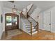 Elegant entryway with hardwood floors and a grand staircase at 132 Rollingwood Ln, Mooresville, NC 28117