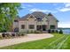 Brick house with a large driveway and manicured lawn at 132 Rollingwood Ln, Mooresville, NC 28117
