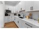 Modern kitchen featuring white shaker cabinets and quartz countertops at 132 Rollingwood Ln, Mooresville, NC 28117