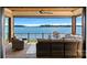 Spacious lakefront patio with wicker furniture at 132 Rollingwood Ln, Mooresville, NC 28117