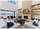 Living room with fireplace and stunning lake views at 132 Rollingwood Ln, Mooresville, NC 28117