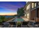 Inviting pool and patio area with tranquil lake view at 132 Rollingwood Ln, Mooresville, NC 28117
