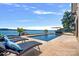 Luxury pool with patio furniture, offering lake views at 132 Rollingwood Ln, Mooresville, NC 28117