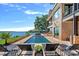 Luxury pool with lounge chairs and lake views at 132 Rollingwood Ln, Mooresville, NC 28117