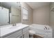 Main bathroom with bathtub, toilet and white vanity at 1529 Brookgreen Ave, Statesville, NC 28677