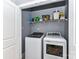 Laundry room with washer, dryer, and shelving at 157 Martingale Ave, Mooresville, NC 28115