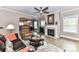 Comfortable living room with fireplace, hardwood floors, and plenty of natural light at 157 Martingale Ave, Mooresville, NC 28115