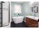 Modern bathroom with a freestanding tub and walk-in shower at 160 Northcrest Dr, Kannapolis, NC 28081