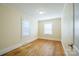 Well-lit bedroom featuring hardwood floors and windows at 168 Park St, Statesville, NC 28677