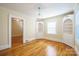 Bright dining room, built-in shelving, hardwood floors at 168 Park St, Statesville, NC 28677