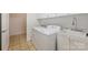 Convenient laundry room with washer, dryer, and utility sink at 2248 Coltsview Ln, Matthews, NC 28105