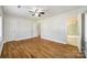 Hardwood floor bedroom with access to bathroom at 2861 Sharon Rd, Charlotte, NC 28211