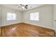 Hardwood floors and two windows in this bright bedroom at 2861 Sharon Rd, Charlotte, NC 28211