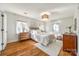 Spacious bedroom with hardwood floors, neutral walls, and ample natural light at 2861 Sharon Rd, Charlotte, NC 28211