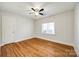 Bright bedroom with hardwood floors and ceiling fan at 2861 Sharon Rd, Charlotte, NC 28211