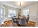 Bright dining room with hardwood floors and a round table for six at 2861 Sharon Rd, Charlotte, NC 28211