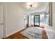 Bright entryway with hardwood floors and large art piece at 2861 Sharon Rd, Charlotte, NC 28211