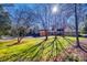 Ranch-style home with a large front yard and mature trees at 2861 Sharon Rd, Charlotte, NC 28211