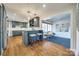 Open kitchen features island with seating, breakfast nook, and sunlit eating area at 2861 Sharon Rd, Charlotte, NC 28211