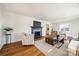 Spacious living room with hardwood floors, fireplace, and ample natural light at 2861 Sharon Rd, Charlotte, NC 28211