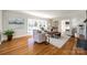 Living room with hardwood floors, fireplace and large windows at 2861 Sharon Rd, Charlotte, NC 28211