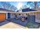 Brick patio with seating area and access to garage at 2861 Sharon Rd, Charlotte, NC 28211