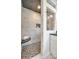 Modern shower with marble tile and a built-in bench at 2861 Sharon Rd, Charlotte, NC 28211