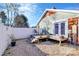 Small deck and gravel backyard with white fence at 326 Stanley Spencer Mtn Rd, Gastonia, NC 28056