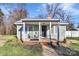 Quaint cottage with covered porch and rocking chairs at 326 Stanley Spencer Mtn Rd, Gastonia, NC 28056