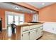 Kitchen island with butcher block countertop and white cabinets at 326 Stanley Spencer Mtn Rd, Gastonia, NC 28056