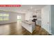 Modern kitchen with light gray cabinets, granite countertops, and an island at 3741 Cullen Meadows Dr, Davidson, NC 28036