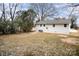 Backyard with a grassy area and some trees at 433 Greenwood Dr, Charlotte, NC 28217
