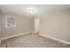 Spacious bedroom with neutral walls and carpet at 433 Greenwood Dr, Charlotte, NC 28217