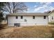 Rear view of a freshly painted house with new AC unit at 433 Greenwood Dr, Charlotte, NC 28217