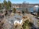 Panoramic view of a home with its large lot, nearby road and lake, and showing the neighborhood's waterfront beauty at 4465 Red Hill Cir, Denver, NC 28037