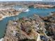 Aerial view of the homesite location on the lakefront with established landscaping and mature trees at 4465 Red Hill Cir, Denver, NC 28037