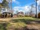 Expansive backyard with well-maintained lawn and a charming pergola and shed for outdoor enjoyment at 4465 Red Hill Cir, Denver, NC 28037