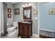 Bathroom with a wood vanity and tile floors at 4465 Red Hill Cir, Denver, NC 28037