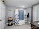 Charming bathroom featuring a standalone tub with blue and white patterned decor at 4465 Red Hill Cir, Denver, NC 28037