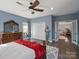 Bedroom featuring a king bed, dresser, closet and an adjoining room at 4465 Red Hill Cir, Denver, NC 28037