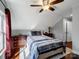 Bedroom with a ceiling fan, natural lighting, hardwood floors, and a cozy atmosphere at 4465 Red Hill Cir, Denver, NC 28037