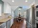 Charming dining area with hardwood floors and a view through multiple windows at 4465 Red Hill Cir, Denver, NC 28037