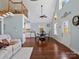Light-filled dining area with hardwood floors, adjacent to the kitchen, with vaulted ceiling at 4465 Red Hill Cir, Denver, NC 28037